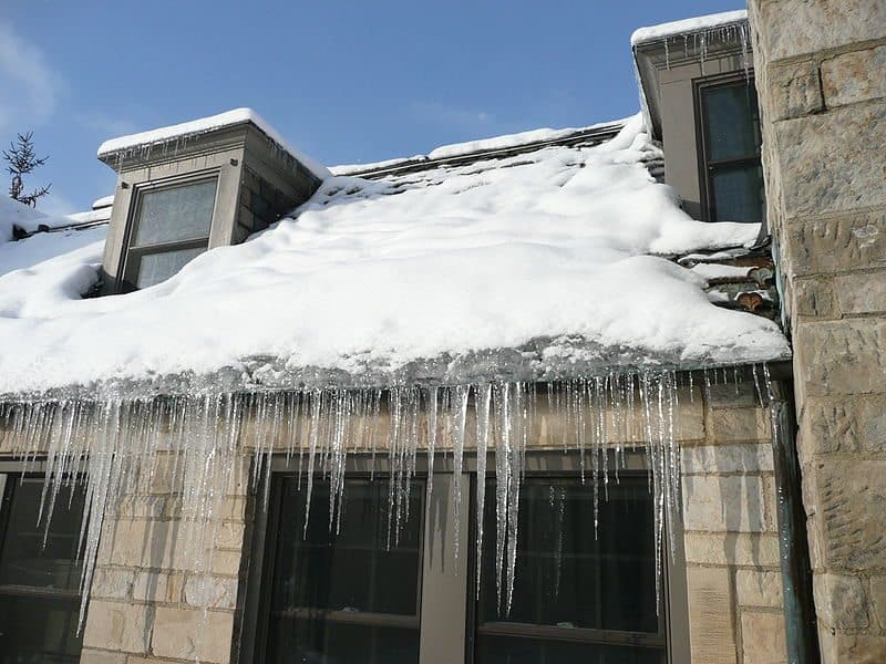 Ice damming may seem harmless, but it can be causing irreparable damage to your roof. (By Dmcroof (Own work) [CC BY-SA 3.0 (http://creativecommons.org/licenses/by-sa/3.0) or GFDL (http://www.gnu.org/copyleft/fdl.html)], via Wikimedia Commons)