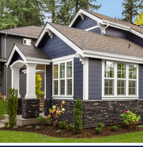 The **exterior** of a **home** with blue siding and white trim.