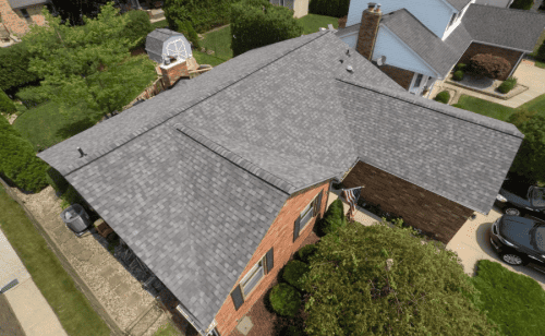 An aerial view of a MI home with a gray roof.