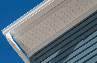 A close up view of a residential gutter on a house.