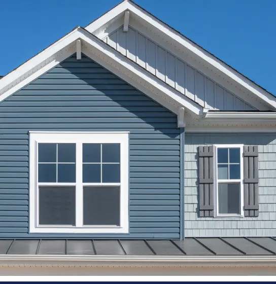 A house with blue vinyl siding, updated by Residential Siding Services.