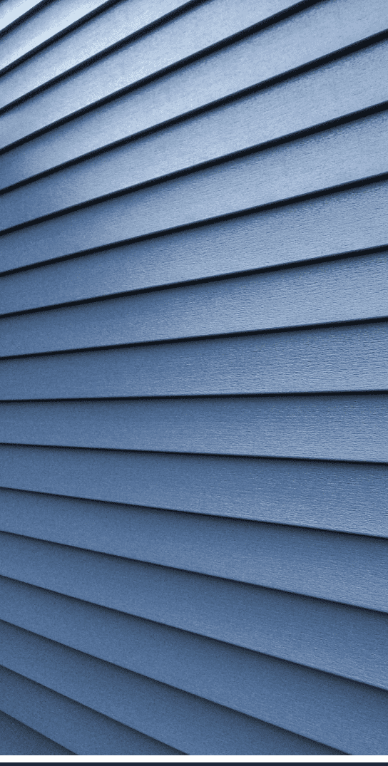 A close up of a blue siding undergoing remodeling.