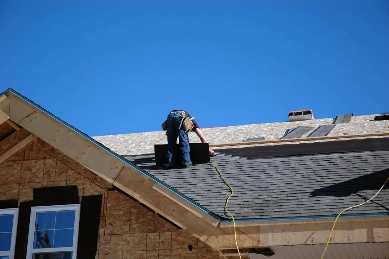 A roofer installing a roof