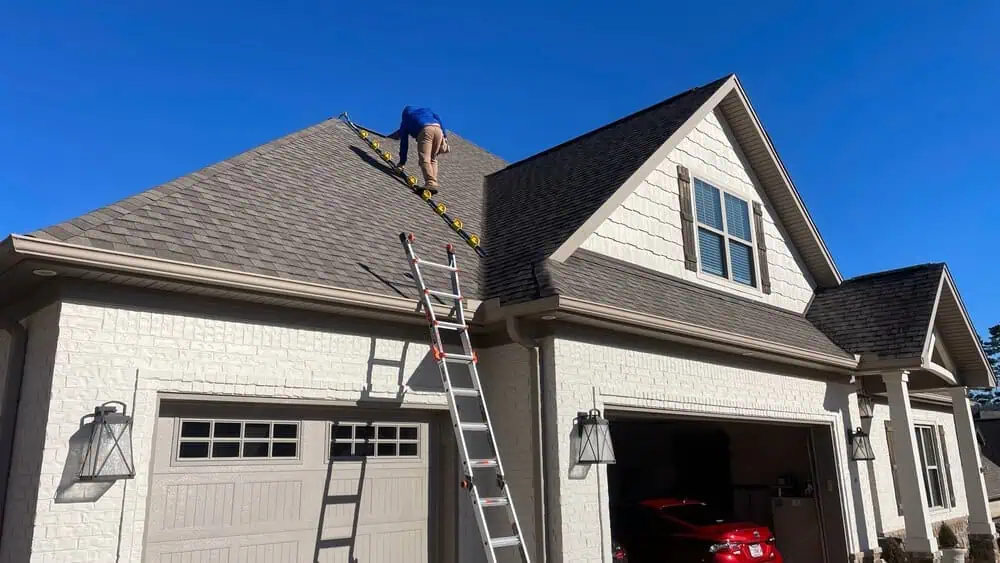 Technician prepares for thorough commercial roof inspection.