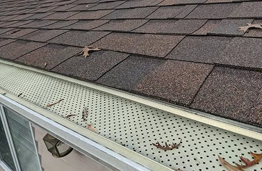 The leading edge tucks under the shingles for a seamless fit