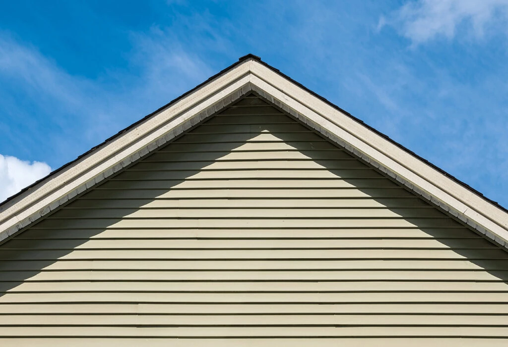 Insulated vinyl siding installed on a residential gable exterior