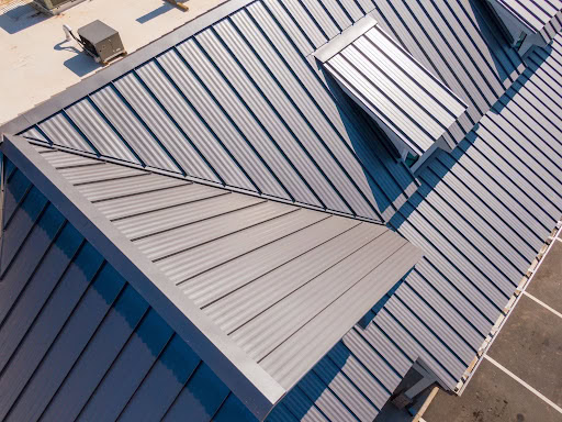 Standing seam metal roofing panels installed on a residential roof